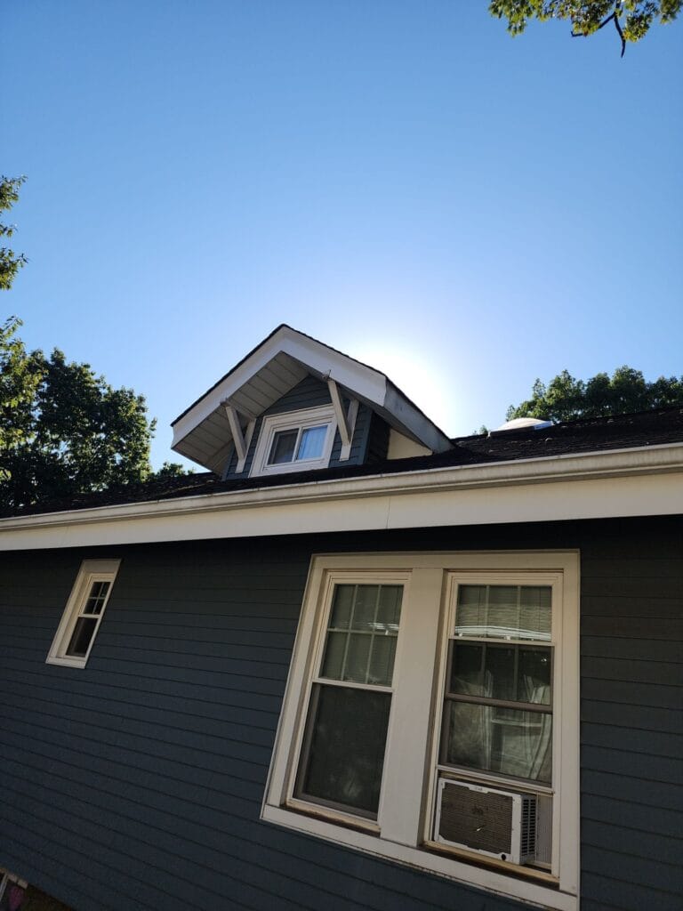 Roof drip edge flashing above gutter