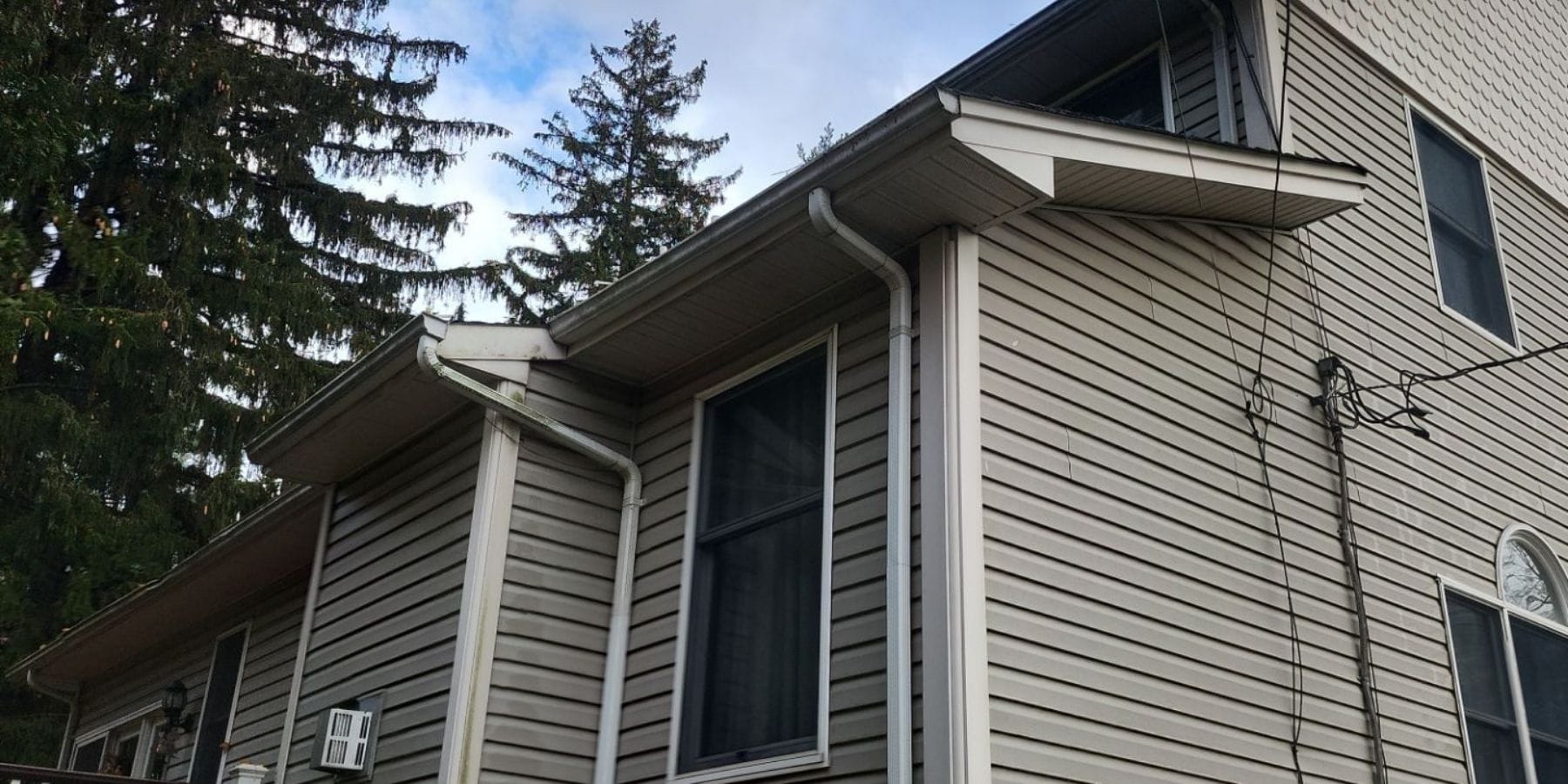 Managing Heavy Rainfall: High-Capacity Gutters and Multi-Downspout Solutions